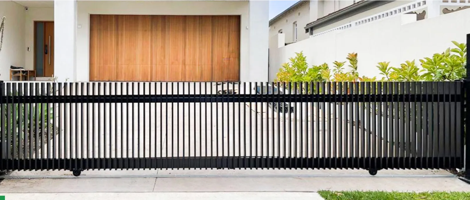 Aluminum cantilever sliding gate on a commercial driveway